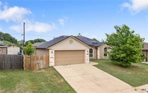 205 W Little Dipper Dr, Killeen, TX 76542 - ranch-style home with concrete driveway, a garage, and solar panels