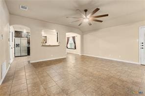 205 W Little Dipper Dr, Killeen, TX 76542 - unfurnished living room with a ceiling fan, arched walkways, baseboards, and vaulted ceiling
