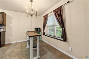 205 W Little Dipper Dr, Killeen, TX 76542 - dining room with a chandelier, baseboards, and tile patterned floors