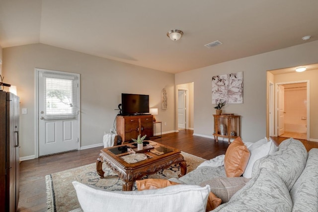 11404 Day Camp Ln, Austin, TX 78754 - living area with wood finished floors, vaulted ceiling, and baseboards