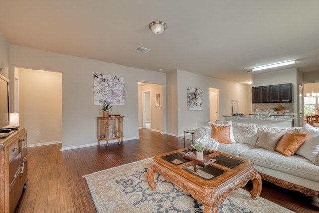 11404 Day Camp Ln, Austin, TX 78754 - living room featuring wood finished floors and baseboards