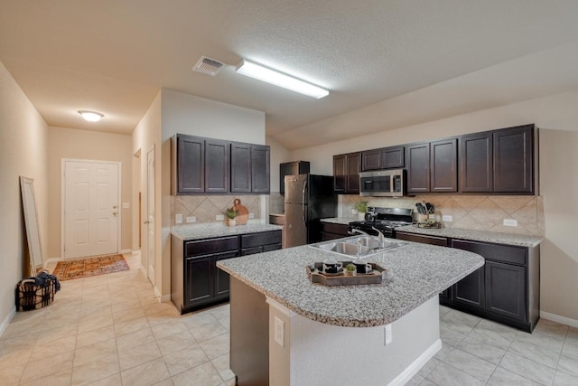 11404 Day Camp Ln, Austin, TX 78754 - kitchen with black appliances, decorative backsplash, light tile patterned floors, a sink, and baseboards
