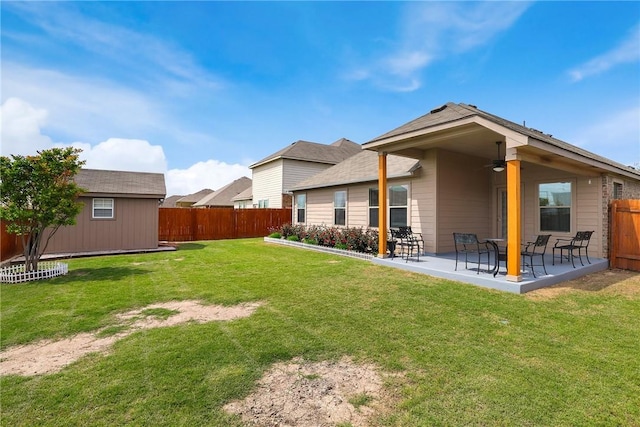 2002 S Ash Cv, Hutto, TX 78634 - back of house with ceiling fan and a patio