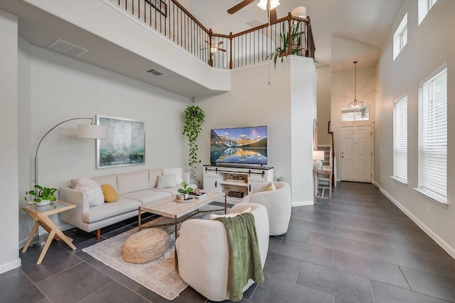 7709 Menchaca Rd Unit 16, Austin, TX 78745 - tiled living room featuring a high ceiling, ceiling fan, and baseboards