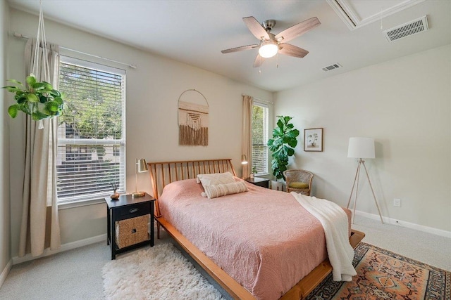 7709 Menchaca Rd Unit 16, Austin, TX 78745 - bedroom featuring light colored carpet, baseboards, attic access, and ceiling fan