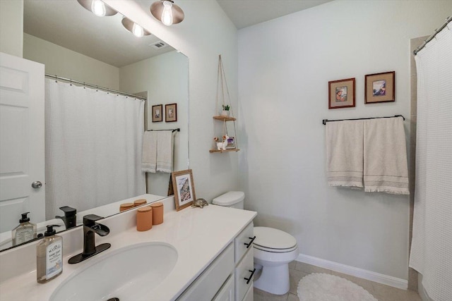 7709 Menchaca Rd Unit 16, Austin, TX 78745 - full bath with vanity, toilet, tile patterned flooring, a shower with shower curtain, and baseboards