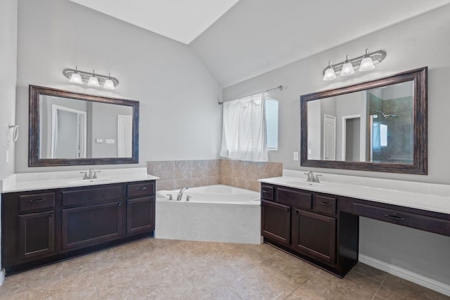3217 Falconers Way, Pflugerville, TX 78660 - bathroom with vaulted ceiling, a bath, two vanities, a shower, and tile patterned flooring