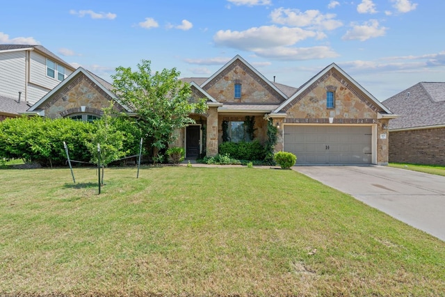 3217 Falconers Way, Pflugerville, TX 78660 - view of front of house with driveway, an attached garage, stone siding, and a front yard