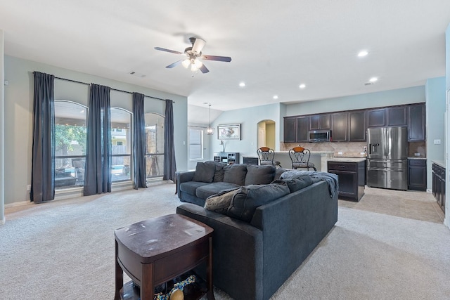 3217 Falconers Way, Pflugerville, TX 78660 - living area with light carpet, a ceiling fan, recessed lighting, and arched walkways