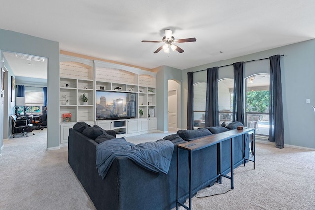 3217 Falconers Way, Pflugerville, TX 78660 - living room featuring light carpet, ceiling fan, and healthy amount of natural light