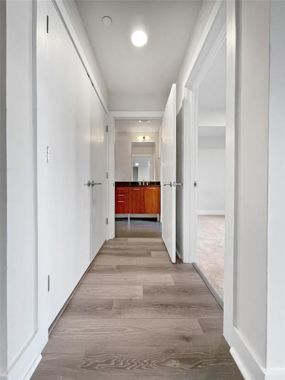 603 Davis St Unit 1108, Austin, TX 78701 - hall featuring wood finished floors