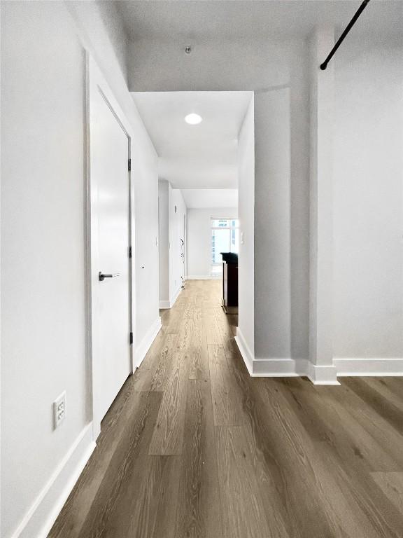 603 Davis St Unit 1108, Austin, TX 78701 - corridor featuring wood finished floors and baseboards
