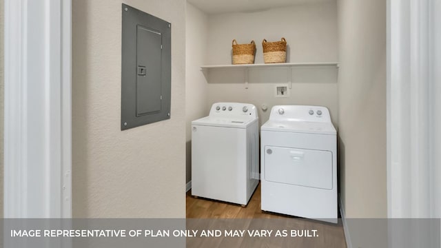 13700 Bothwell Pl, Manor, TX 78653 - laundry area featuring electric panel, independent washer and dryer, and wood finished floors