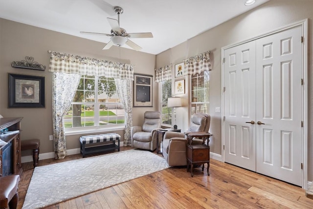 115 Durango Trl, Georgetown, TX 78633 - living area with a ceiling fan, wood finished floors, and baseboards