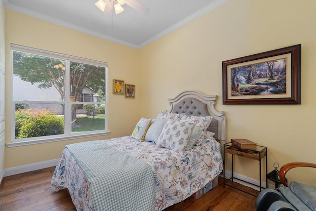115 Durango Trl, Georgetown, TX 78633 - bedroom featuring multiple windows, baseboards, wood finished floors, and crown molding