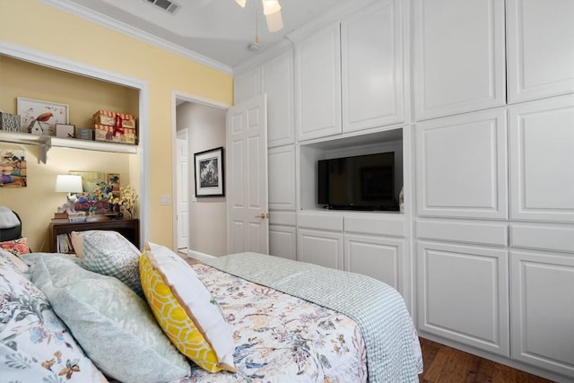 115 Durango Trl, Georgetown, TX 78633 - bedroom with crown molding, dark wood-style flooring, and a ceiling fan
