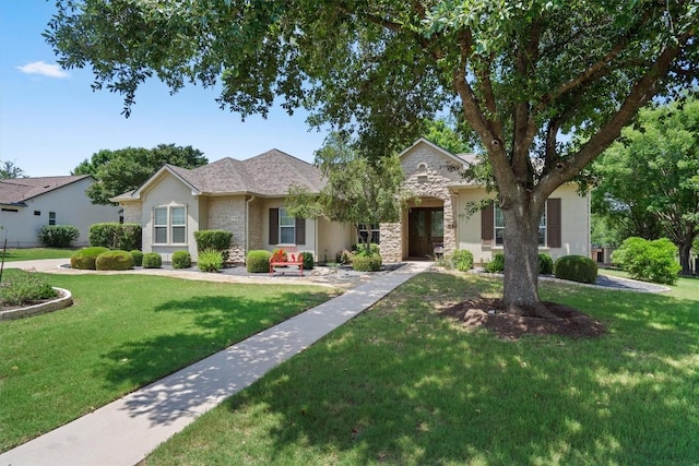 115 Durango Trl, Georgetown, TX 78633 - ranch-style home featuring stucco siding, a front lawn, and stone siding