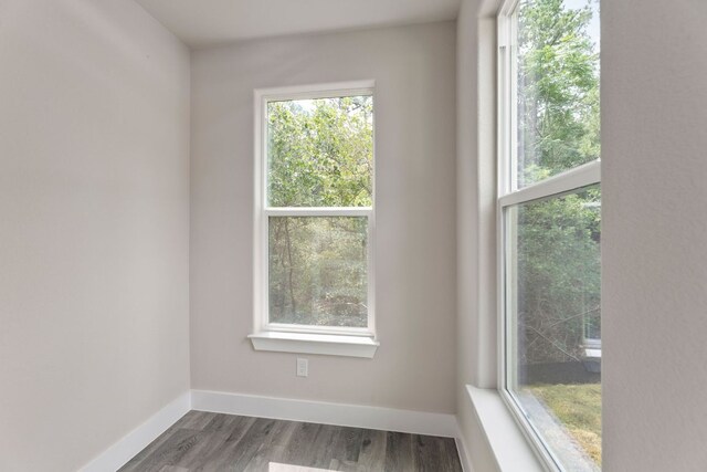 182 Kaanapali Ln, Bastrop, TX 78602 - unfurnished room featuring baseboards and wood finished floors