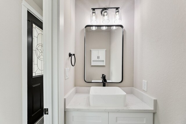 182 Kaanapali Ln, Bastrop, TX 78602 - bathroom with vanity and a textured wall