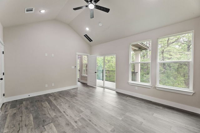 182 Kaanapali Ln, Bastrop, TX 78602 - unfurnished room with ceiling fan, wood finished floors, high vaulted ceiling, and recessed lighting