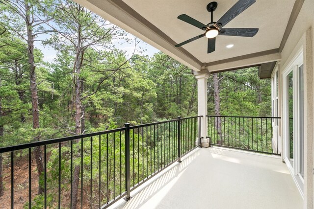 182 Kaanapali Ln, Bastrop, TX 78602 - balcony featuring a ceiling fan and a wooded view
