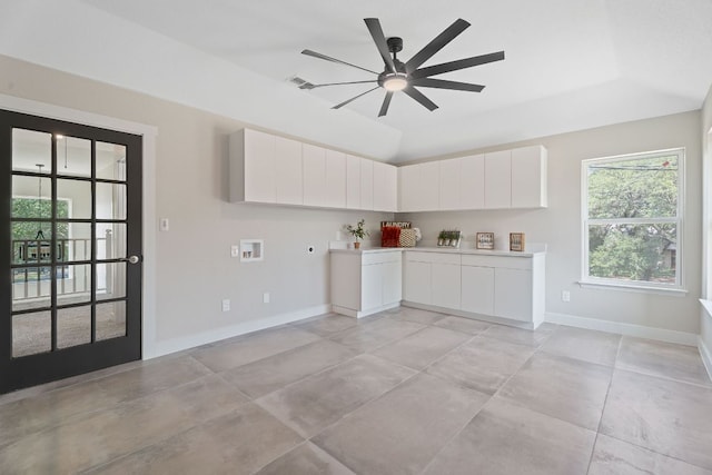 100 Toltec Cv, Kyle, TX 78640 - kitchen featuring baseboards, white cabinets, light countertops, and ceiling fan