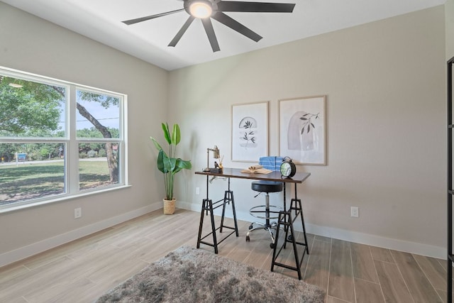 100 Toltec Cv, Kyle, TX 78640 - office space featuring ceiling fan, wood finished floors, and baseboards