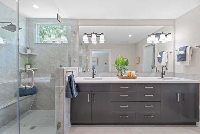 100 Toltec Cv, Kyle, TX 78640 - bathroom with double vanity and a shower stall