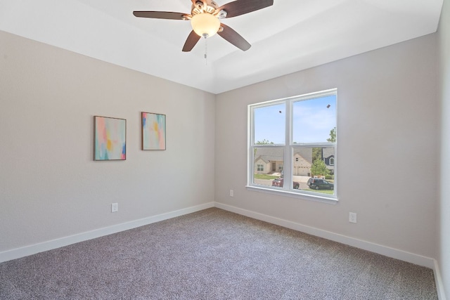 100 Toltec Cv, Kyle, TX 78640 - unfurnished room featuring light carpet, baseboards, and a ceiling fan