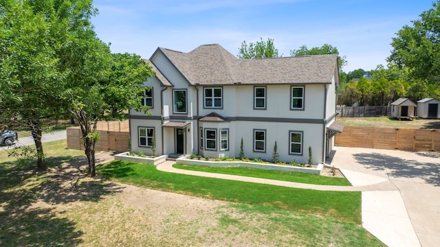 100 Toltec Cv, Kyle, TX 78640 - view of front of property with driveway, stucco siding, and a shingled roof