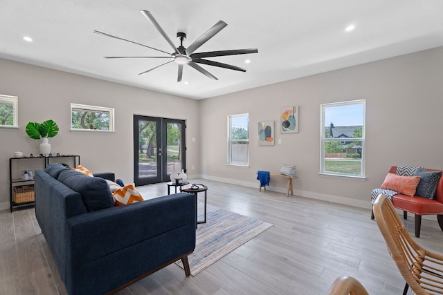 100 Toltec Cv, Kyle, TX 78640 - living room featuring a ceiling fan, recessed lighting, wood finished floors, and baseboards