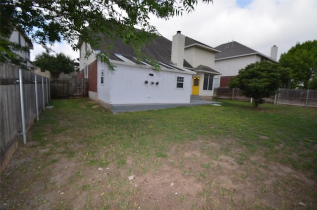 840 Smoke Signal Pass, Pflugerville, TX 78660 - back of house featuring a chimney