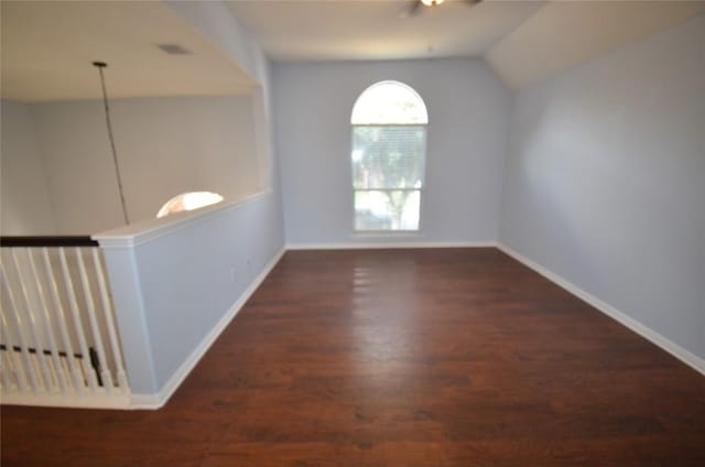 840 Smoke Signal Pass, Pflugerville, TX 78660 - empty room with vaulted ceiling, wood finished floors, a ceiling fan, and baseboards