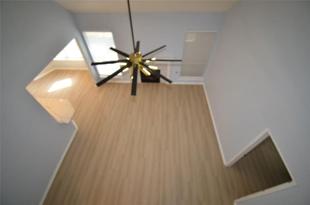 840 Smoke Signal Pass, Pflugerville, TX 78660 - detailed view of baseboards, wood finished floors, and a ceiling fan