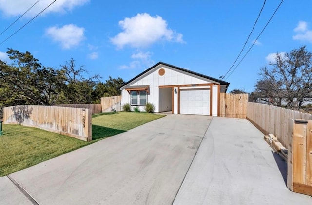 249 Hill Dr, Granite Shoals, TX 78654 - view of front of property with driveway, an attached garage, and board and batten siding