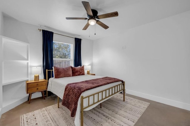 249 Hill Dr, Granite Shoals, TX 78654 - bedroom featuring baseboards, a ceiling fan, and concrete flooring