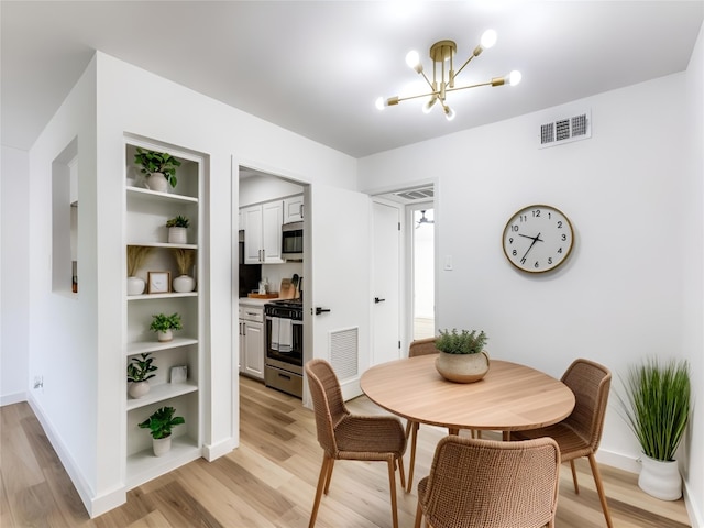 7920 Rockwood Ln Unit 208, Austin, TX 78757 - dining room with a chandelier, light wood-type flooring, baseboards, and built in features