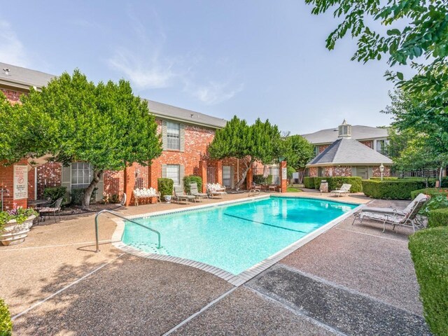 7920 Rockwood Ln Unit 208, Austin, TX 78757 - community pool featuring a patio