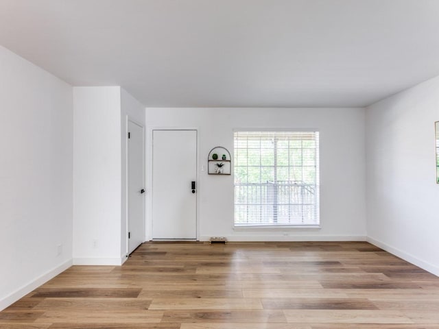 7920 Rockwood Ln Unit 208, Austin, TX 78757 - foyer with light wood-style flooring and baseboards