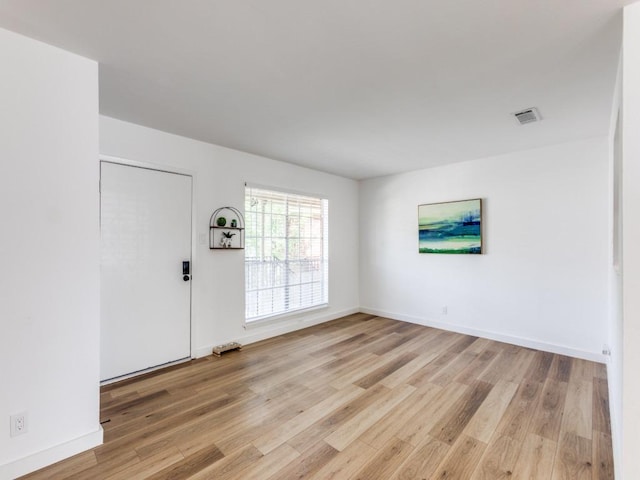 7920 Rockwood Ln Unit 208, Austin, TX 78757 - foyer entrance with light wood-style flooring and baseboards