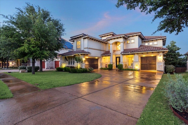 613 Horseback Holw, Austin, TX 78732 - mediterranean / spanish-style house with concrete driveway, a tile roof, stucco siding, and an attached garage