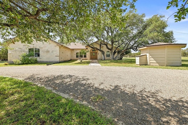 217 Circle Oaks Dr, Burnet, TX 78611 - rear view of property with a yard