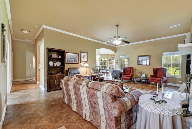 217 Circle Oaks Dr, Burnet, TX 78611 - living area featuring ornamental molding, arched walkways, baseboards, a ceiling fan, and tile patterned flooring