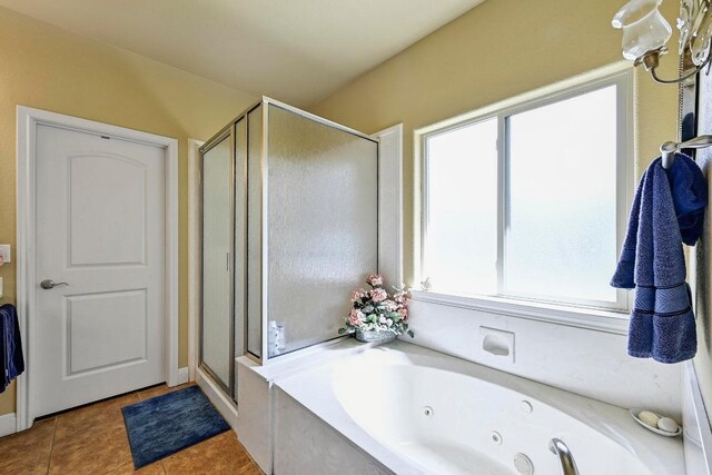 217 Circle Oaks Dr, Burnet, TX 78611 - full bathroom featuring a stall shower, healthy amount of natural light, and a tub with jets