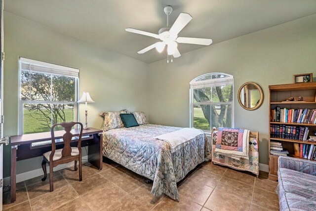217 Circle Oaks Dr, Burnet, TX 78611 - bedroom with tile patterned floors and ceiling fan