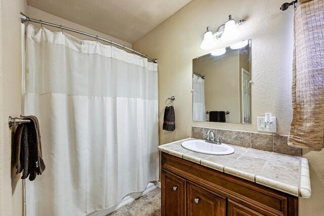 217 Circle Oaks Dr, Burnet, TX 78611 - full bathroom with vanity and curtained shower