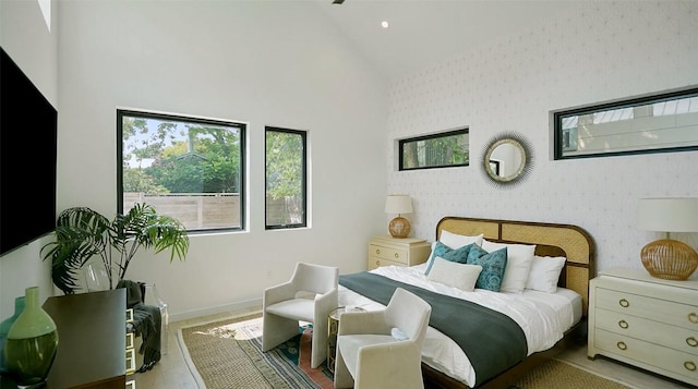 2010 Oxford Ave, Austin, TX 78704 - bedroom with high vaulted ceiling, wood finished floors, recessed lighting, and baseboards