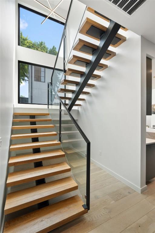 2010 Oxford Ave, Austin, TX 78704 - staircase featuring wood finished floors and baseboards