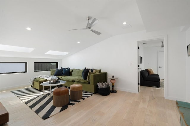 2010 Oxford Ave, Austin, TX 78704 - living room featuring a skylight, lofted ceiling, light wood finished floors, recessed lighting, and a ceiling fan