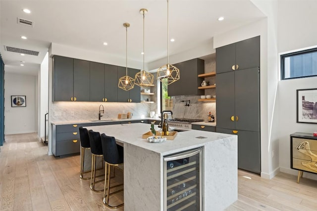 2010 Oxford Ave, Austin, TX 78704 - kitchen with open shelves, wine cooler, light wood-style floors, tasteful backsplash, and recessed lighting
